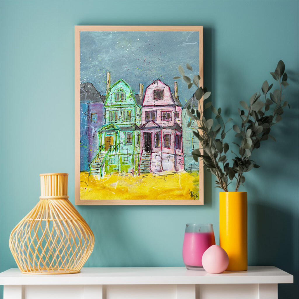 Mockup image of #SistersNotTwins painting displayed in a wooden frame above a shelf adorned with decorative vases and candles, showcasing the artwork in a cozy living setting.